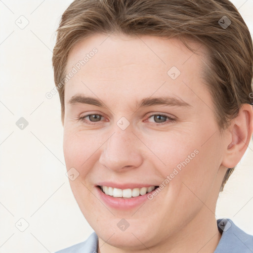 Joyful white young-adult female with short  brown hair and grey eyes