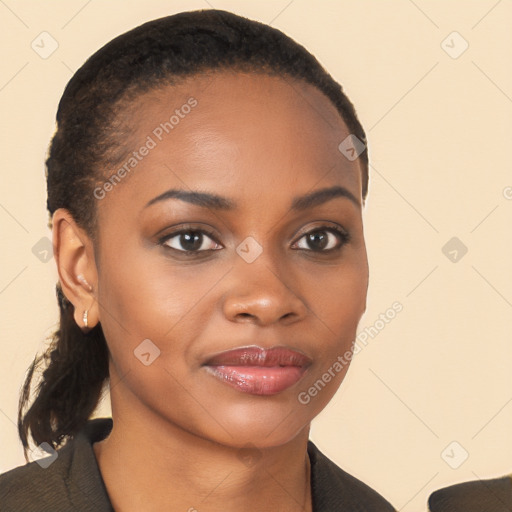 Joyful black young-adult female with long  brown hair and brown eyes