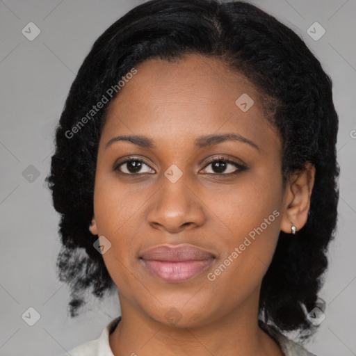 Joyful black young-adult female with medium  black hair and brown eyes