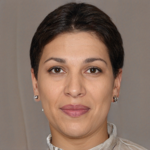 Joyful white adult female with short  brown hair and brown eyes