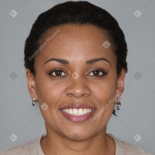 Joyful black young-adult female with short  brown hair and brown eyes