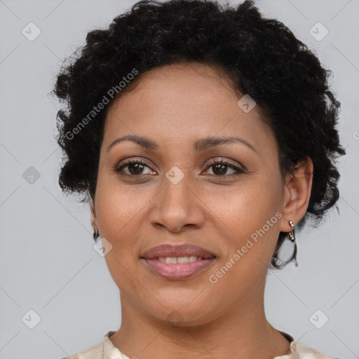 Joyful latino adult female with short  brown hair and brown eyes