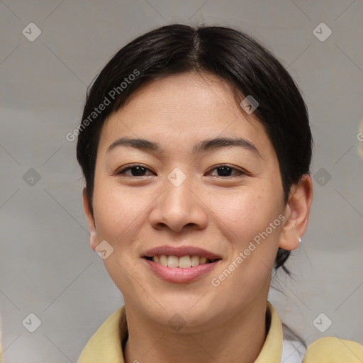 Joyful asian young-adult female with short  brown hair and brown eyes