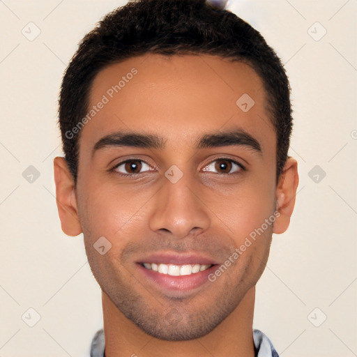 Joyful latino young-adult male with short  brown hair and brown eyes