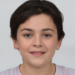 Joyful white child female with short  brown hair and brown eyes