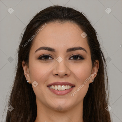 Joyful white young-adult female with long  brown hair and brown eyes