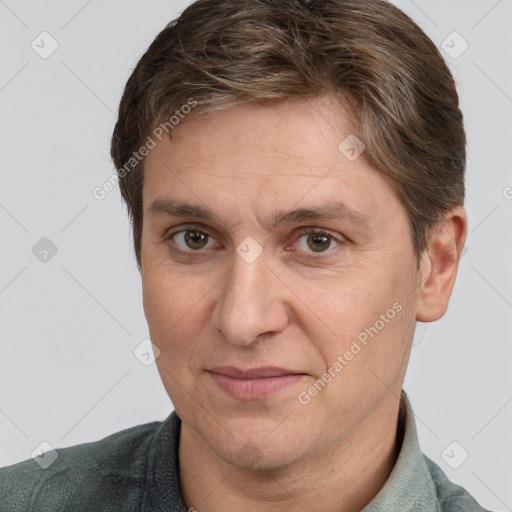 Joyful white adult male with short  brown hair and grey eyes