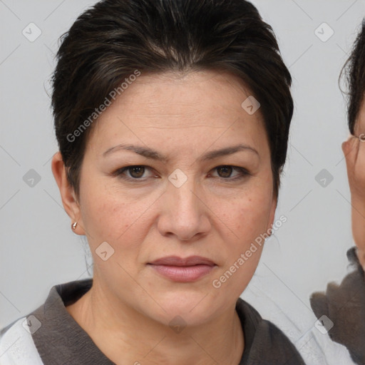 Joyful white adult female with short  brown hair and brown eyes