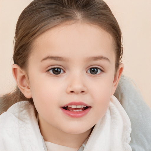 Joyful white child female with medium  brown hair and brown eyes