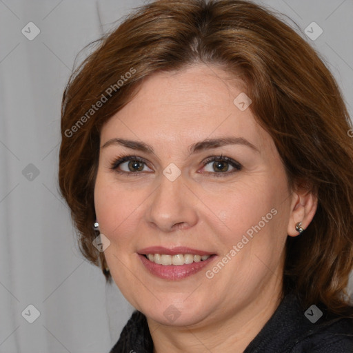 Joyful white adult female with medium  brown hair and brown eyes