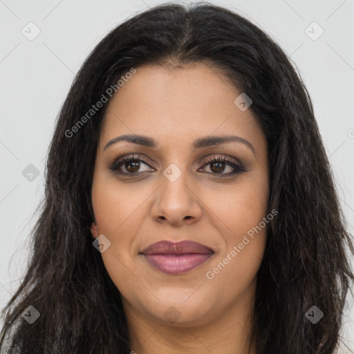 Joyful latino young-adult female with long  brown hair and brown eyes