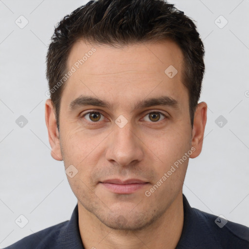 Joyful white young-adult male with short  brown hair and brown eyes