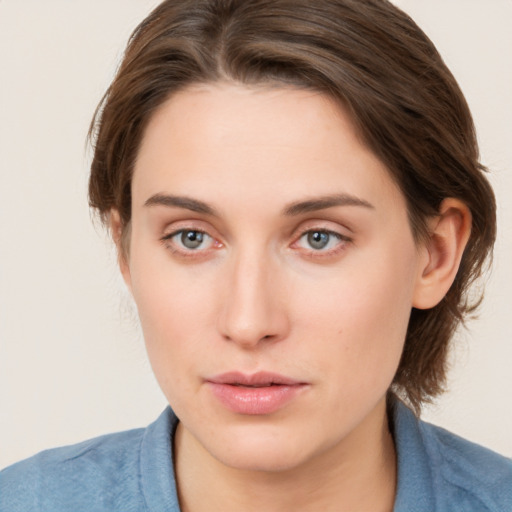 Neutral white young-adult female with medium  brown hair and grey eyes