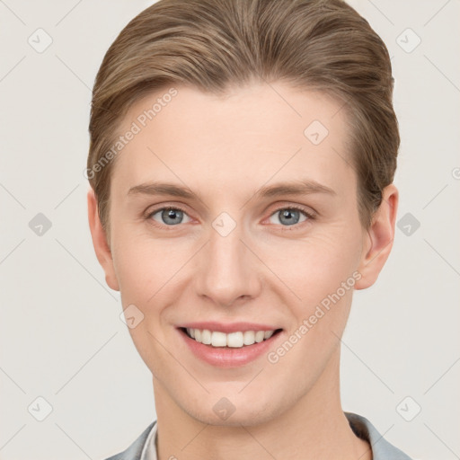 Joyful white young-adult female with short  brown hair and grey eyes