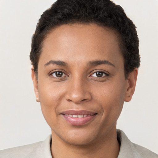 Joyful white young-adult female with short  brown hair and brown eyes