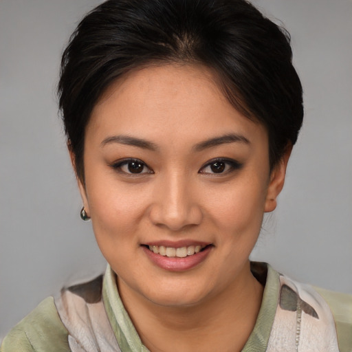 Joyful latino young-adult female with short  brown hair and brown eyes