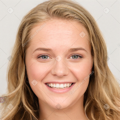 Joyful white young-adult female with long  brown hair and blue eyes