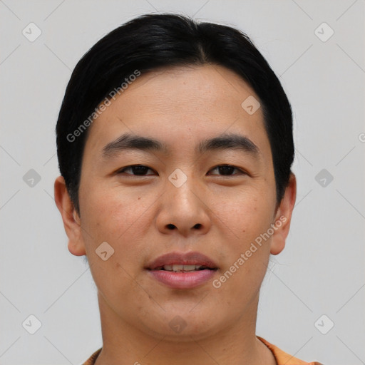 Joyful asian young-adult male with short  black hair and brown eyes