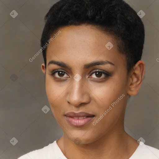 Joyful black young-adult female with short  black hair and brown eyes