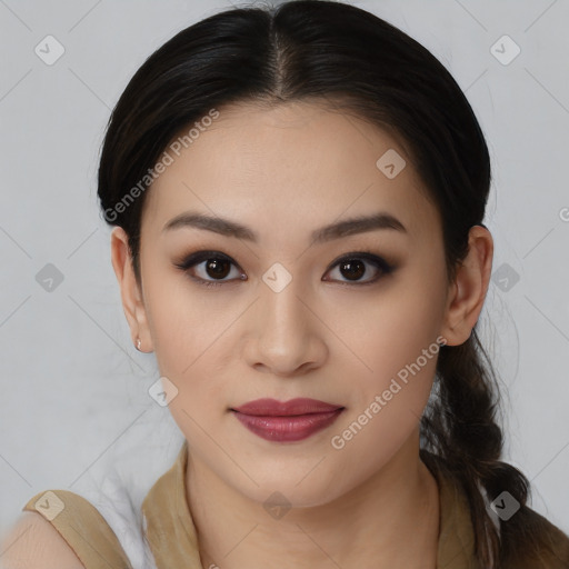 Joyful latino young-adult female with long  brown hair and brown eyes