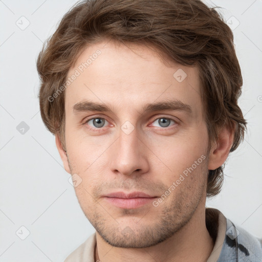 Neutral white young-adult male with short  brown hair and grey eyes