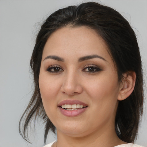 Joyful asian young-adult female with medium  brown hair and brown eyes