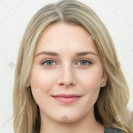 Joyful white young-adult female with long  brown hair and green eyes