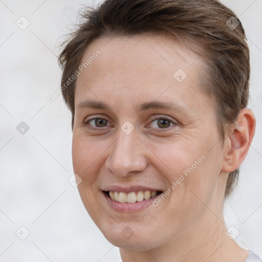 Joyful white adult female with short  brown hair and brown eyes