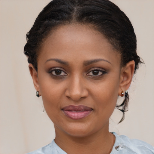 Joyful black young-adult female with short  brown hair and brown eyes