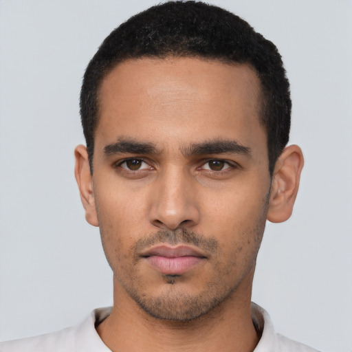 Neutral latino young-adult male with short  black hair and brown eyes