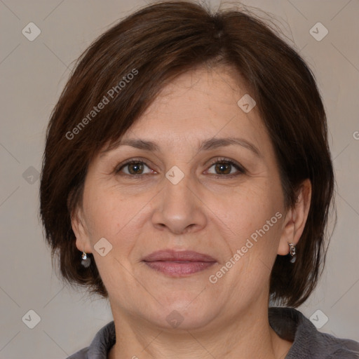 Joyful white adult female with medium  brown hair and brown eyes