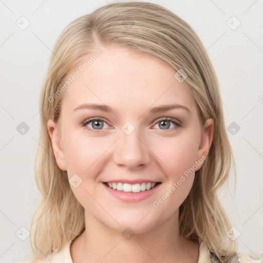 Joyful white young-adult female with medium  brown hair and blue eyes