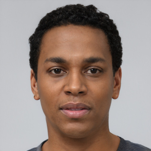 Neutral black young-adult male with short  black hair and brown eyes