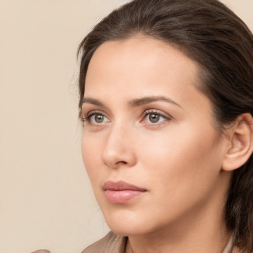 Neutral white young-adult female with medium  brown hair and brown eyes