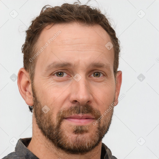 Joyful white adult male with short  brown hair and grey eyes