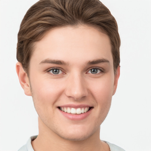 Joyful white young-adult female with short  brown hair and grey eyes