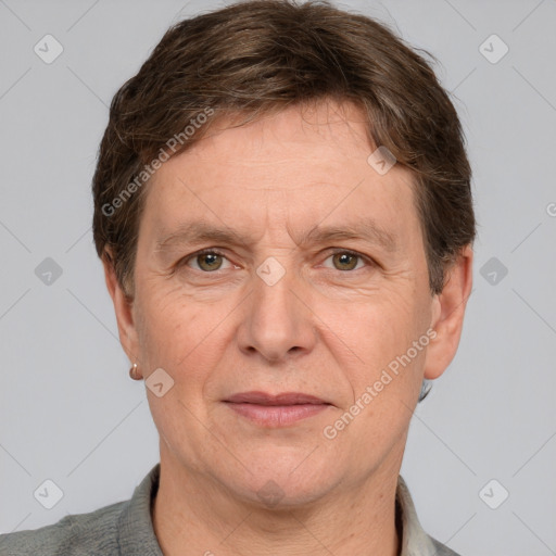 Joyful white adult male with short  brown hair and grey eyes