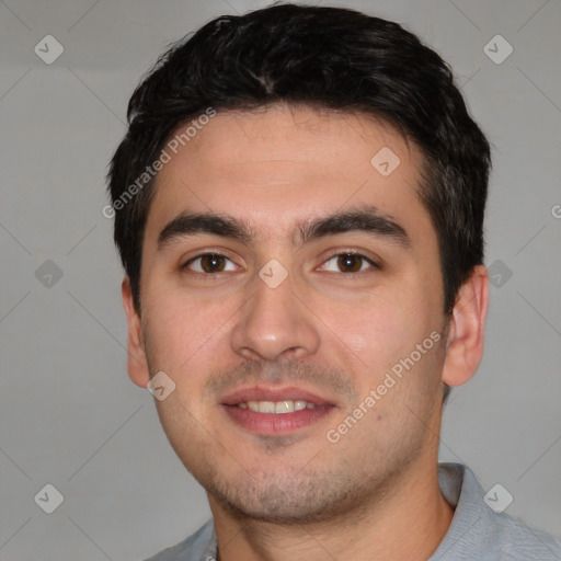 Joyful white young-adult male with short  black hair and brown eyes