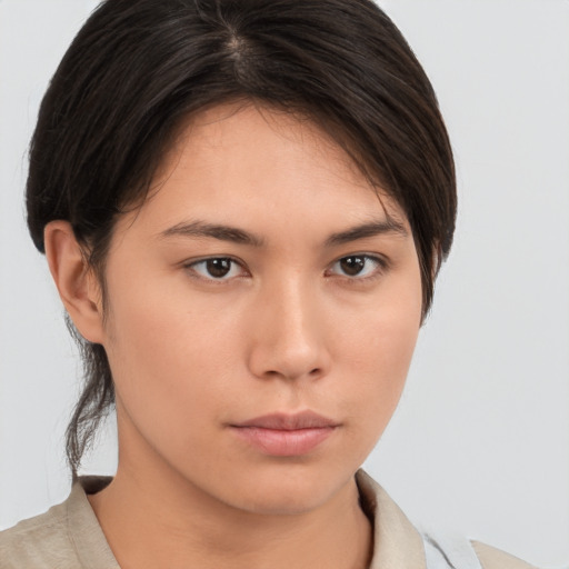 Neutral asian young-adult female with medium  brown hair and brown eyes