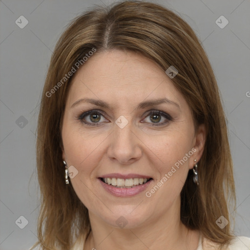 Joyful white adult female with medium  brown hair and grey eyes