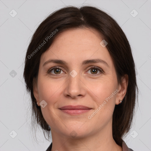 Joyful white adult female with medium  brown hair and brown eyes