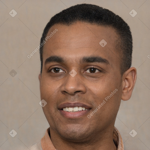 Joyful black young-adult male with short  black hair and brown eyes