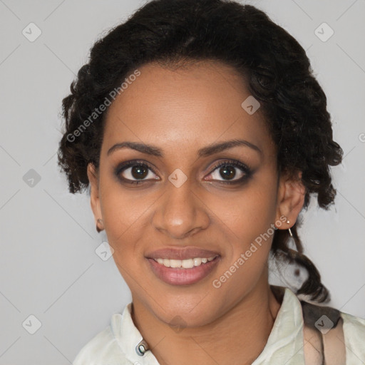 Joyful black young-adult female with short  brown hair and brown eyes