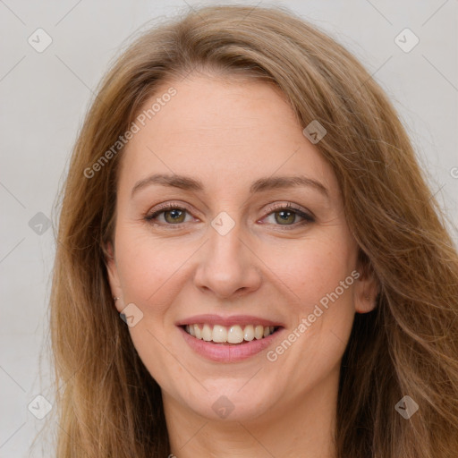 Joyful white young-adult female with long  brown hair and green eyes