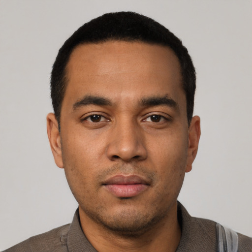 Neutral latino young-adult male with short  black hair and brown eyes
