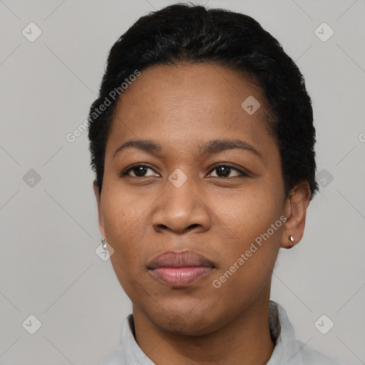 Joyful black young-adult female with short  black hair and brown eyes