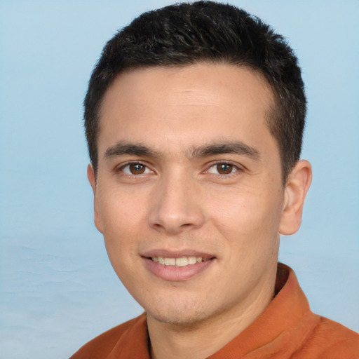 Joyful white young-adult male with short  black hair and brown eyes