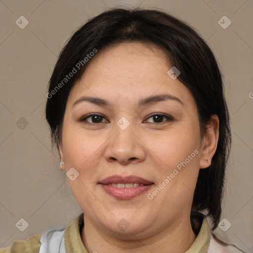 Joyful latino adult female with medium  brown hair and brown eyes