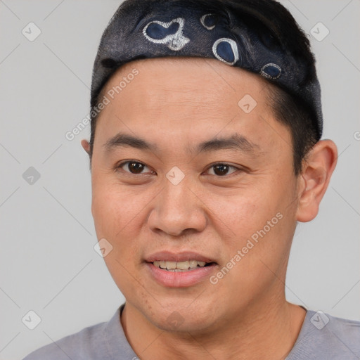 Joyful asian young-adult male with short  black hair and brown eyes