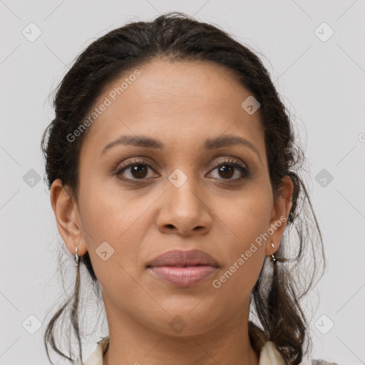 Joyful latino young-adult female with long  brown hair and brown eyes